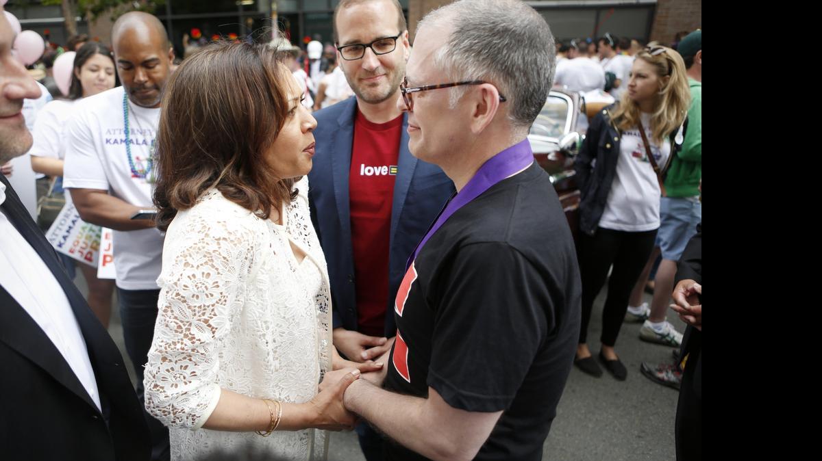 
Jim Obergefell embraces California Attorney General Kamala Harris during the San Francisco Pride Parade on Sunday in San Francisco, two days after the Supreme Court's landmark decision to require that states issue marriage licenses to same sex couples. Obergefell, the plaintiff in the Supreme Court case, began his legal battle for marriage equality so he would be recognized as legally married to his late husband, John Arthur.
