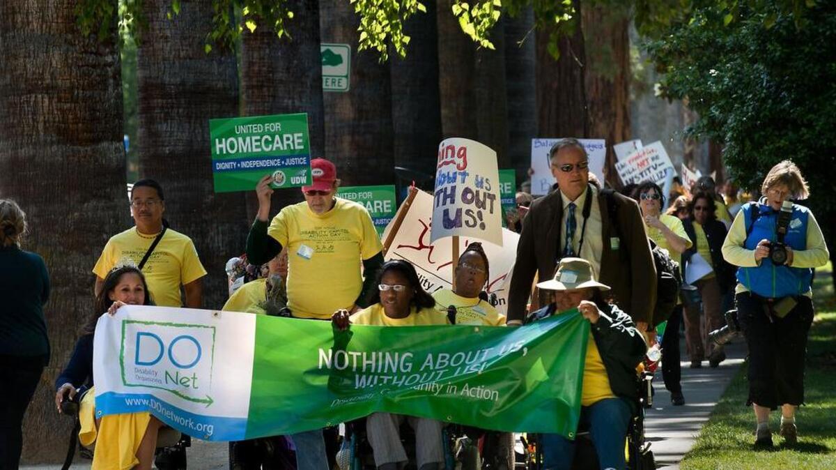 
Approximately 100 people, many of them disabled, march along L Street to the Capitol advocating for disabled people during the Disability Capitol Action Day in Sacramento in May 2013.

