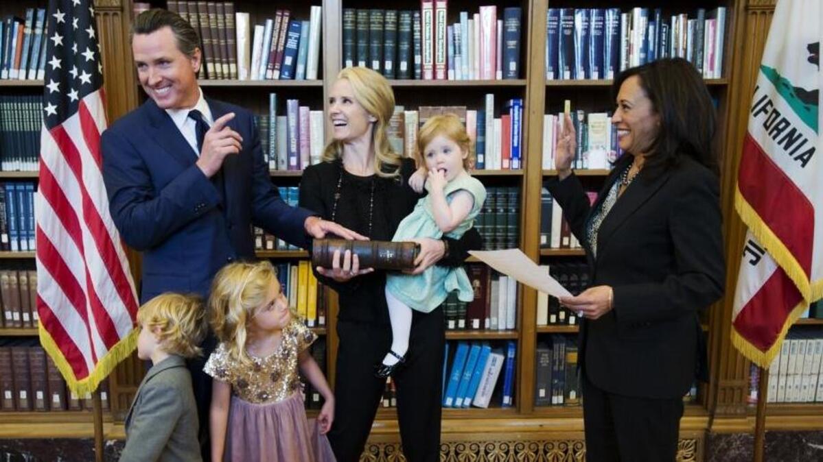 
Lt. Gov. Gavin Newsom is sworn into his second term in the office by state Attorney General Kamala Harris on Jan. 5, 2015, in Sacramento. Newsom is joined by his wife, Jennifer Siebel Newsom, and their children Montana, 5, Hunter, 4, and Brooklynn, 2.