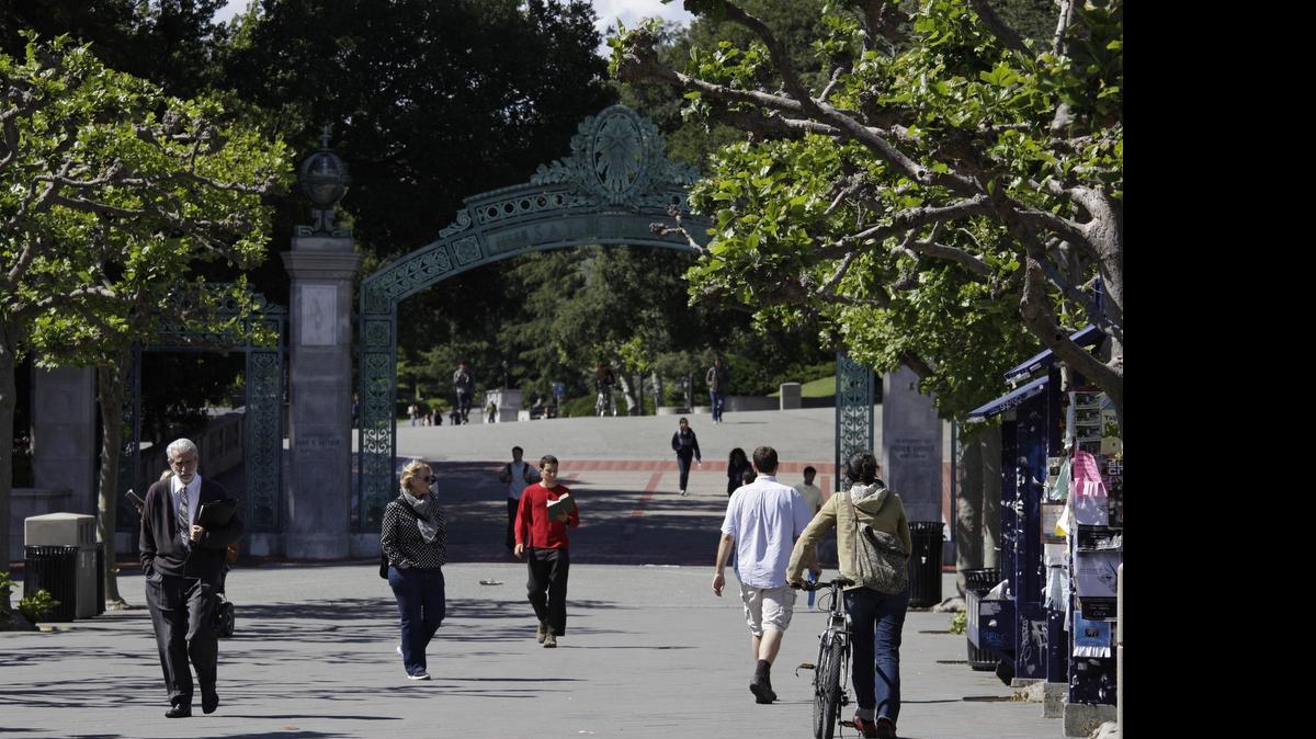 
People walk through Sproul Plaza near the Sather Gate at the University of California, Berkeley.
