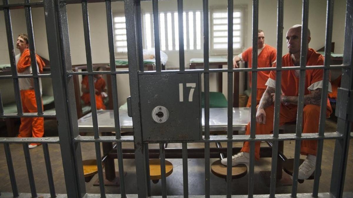 Inmates wait in the Roger Bauman intake facility at the Rio Cosumnes Correctional Center in Elk Grove, California on March 01, 2012 .