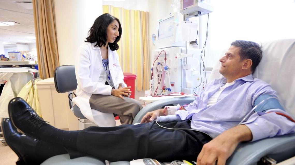 Dr. Manjula Tamura speaks with Joe Kostmayer as he undergoes dialysis at a Veterans Affairs hospital in Palo Alto, Calif., March 10, 2011. A California Senate bill attempts to establish more stringent regulations for dialysis centers in the state.