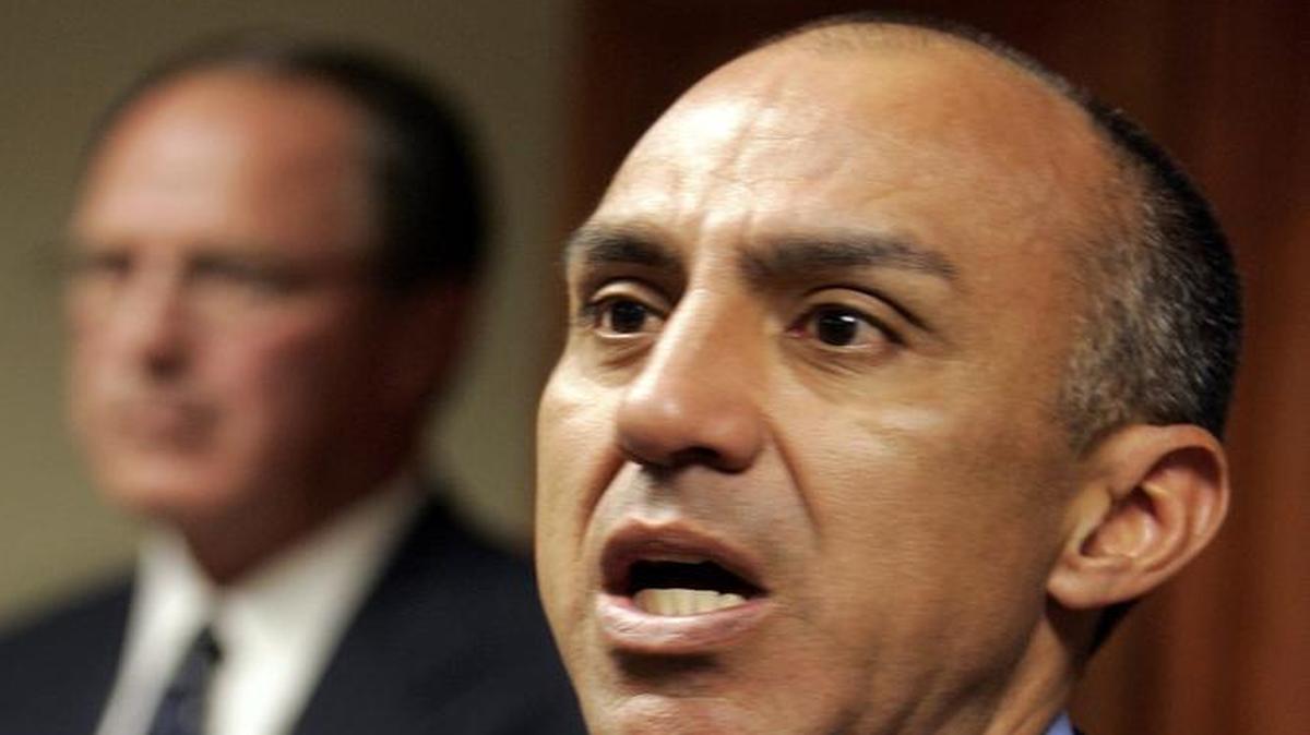 Michael Ramos, San Bernardino County District Attorney, speaks during a news conference as the county sheriff Gary Penrod listens in the background Tuesday, March 7, 2006, in San Bernardino.