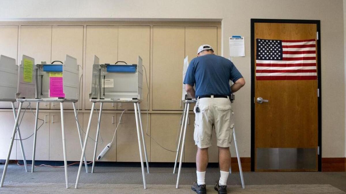 A-61year old resident of West Sacramento votes in a room at fire station #45 on Tuesday, June 3, 2014.