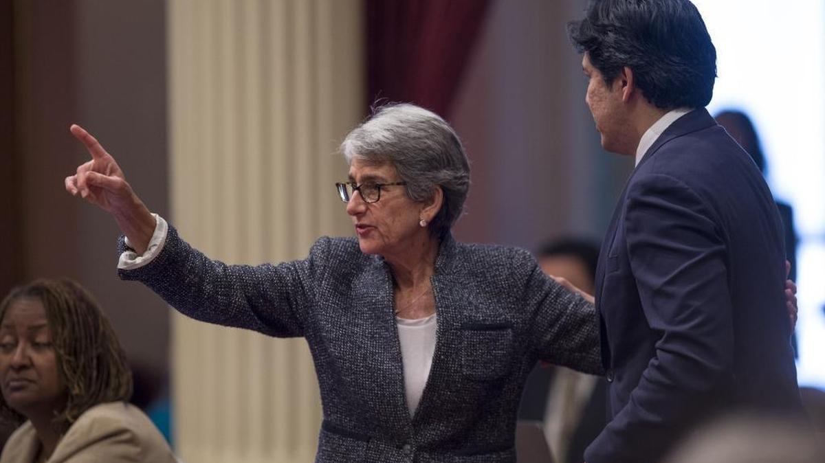 California Senate President Pro Tem Kevin de León embraces Sen. Hannah-Beth Jackson, D-Santa Barbara as she casts her vote for the state budget on Wednesday afternoon, June 15 2016 at the California State Capitol.