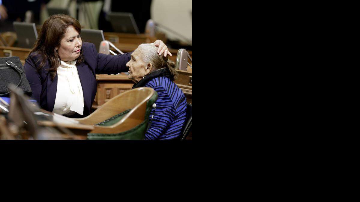 
Freshman Assembly member Patty Lopez, D-San Fernando, left, helps her mother, Maria de Jesus, with her hair before the start of the Assembly session on Dec. 1, 2014. Lopez defeated incumbent Raul Bocanegra, D-Los Angeles by 466 votes.

