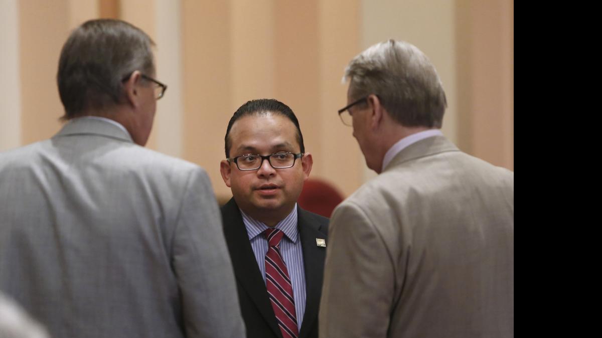 
In this photo taken Thursday, Sept. 12, 2013, Assemblyman Luis Alejo, D-Watsonville, center, talks with state Senators Tom Berryhill, R-Twain Harte, left, and William Monning, D-Carmel/
