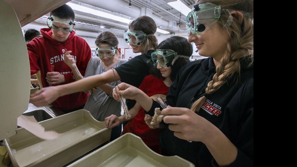 
Students crowd around the sink to rinse test tubes during a biology class at Bella Vista High School. San Juain Unified Schol District plans a science wing at the school to relieve overcrowding in science classes.
