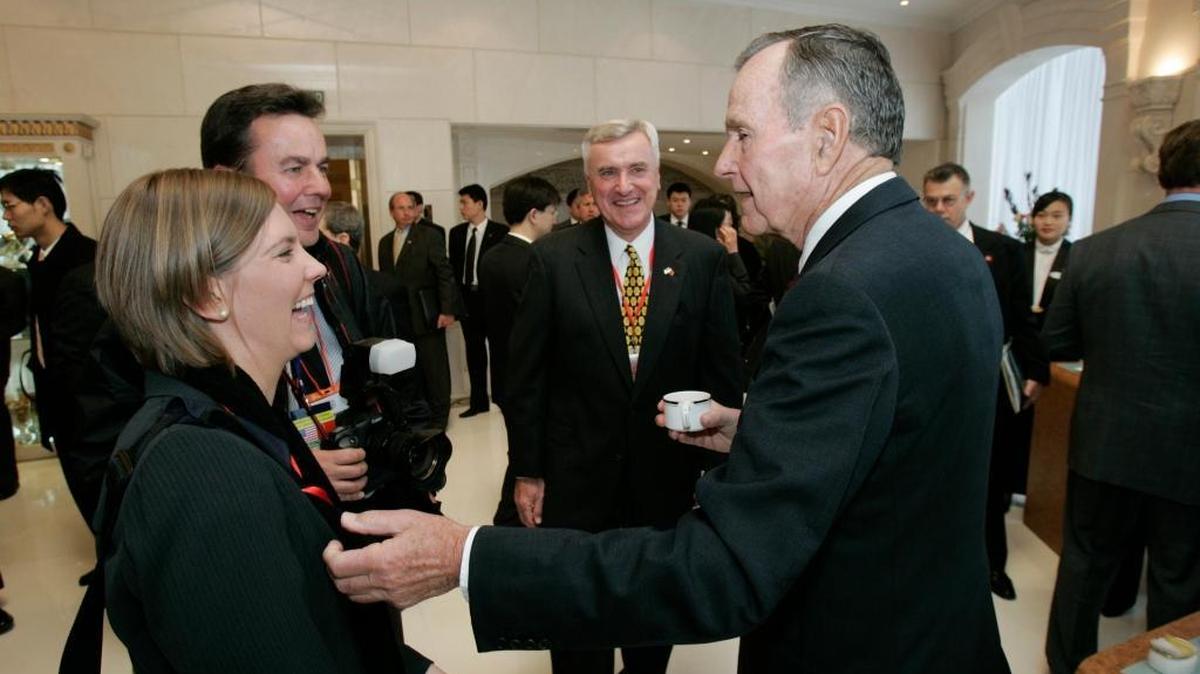 Julie Soderlund shares a laugh with former President George H. W. Bush during a trip to China on Nov. 15, 2005. Soderlund was there as a communications aide to then-Gov. Arnold Schwarzenegger.