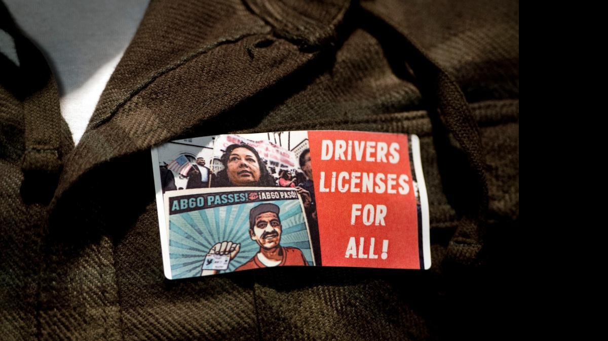Proponents wore stickers touting driver’s licenses for those in the country illegally at a capital hearing in January 2014 that helped set rules for the law.