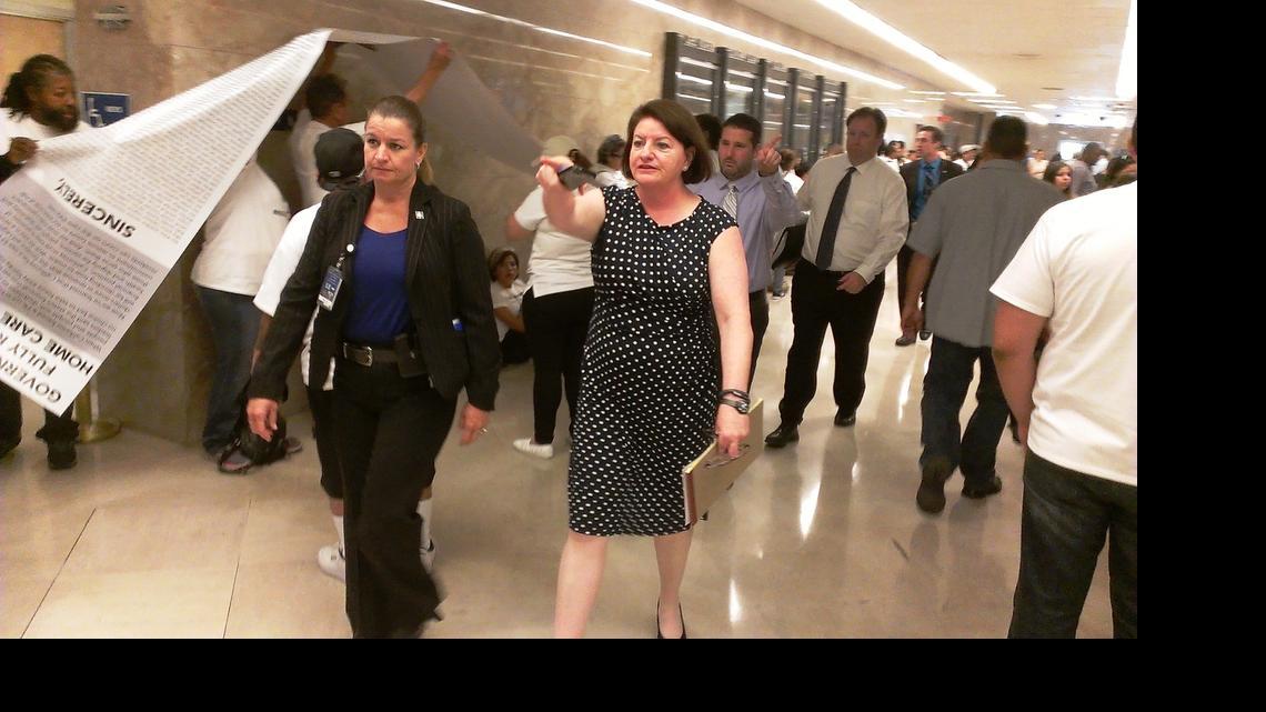 
Assembly Speaker Toni Atkins, D-San Diego (center) passes home-care workers seeking a restoration of hours after leaving Gov. Jerry Brown’s office Monday morning.
