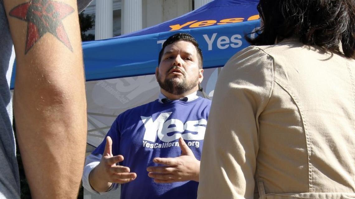 Marcus Ruiz Evans, center, vice president of the Yes California independence campaign, talks about California seceding on Nov. 9, 2016, in Sacramento.