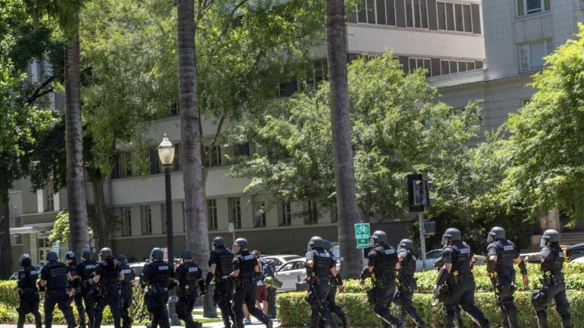 Police surround the California Capitol on June 28 as clashes broke out between skinhead and “anti-fascist” protesters. Several people were stabbed.