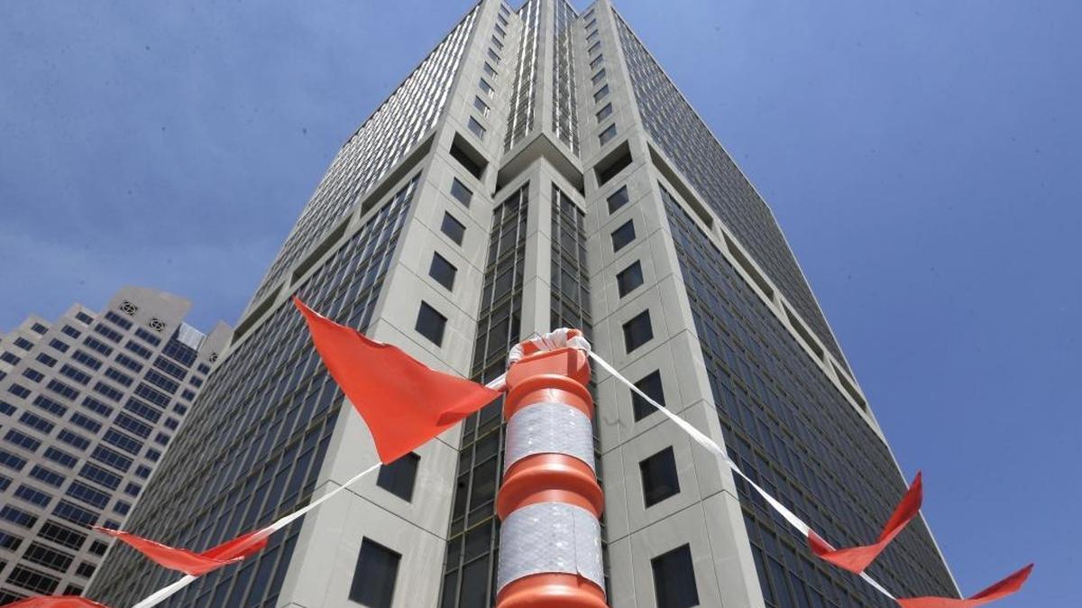 In this Wednesday, July 2, 2014 photo, warning flags hang on the parking garage of the State Board of Equalization building in Sacramento.