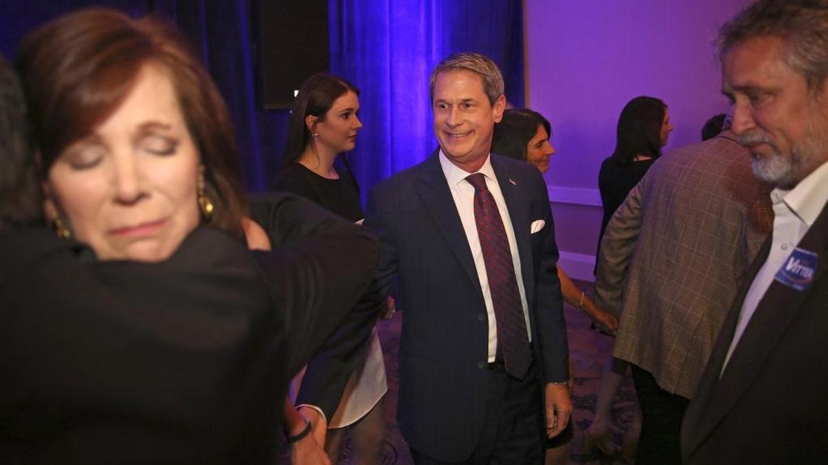 Louisiana gubernatorial candidate Sen. David Vitter, R-La., center, and his wife Wendy, left, are comforted by their supporters after announcing his defeat at his election night watch party in Kenner, La., Saturday. Vitter said he is not going to run again for the U.S. Senate after losing in an upset race for governor to Democrat John Bel Edwards.