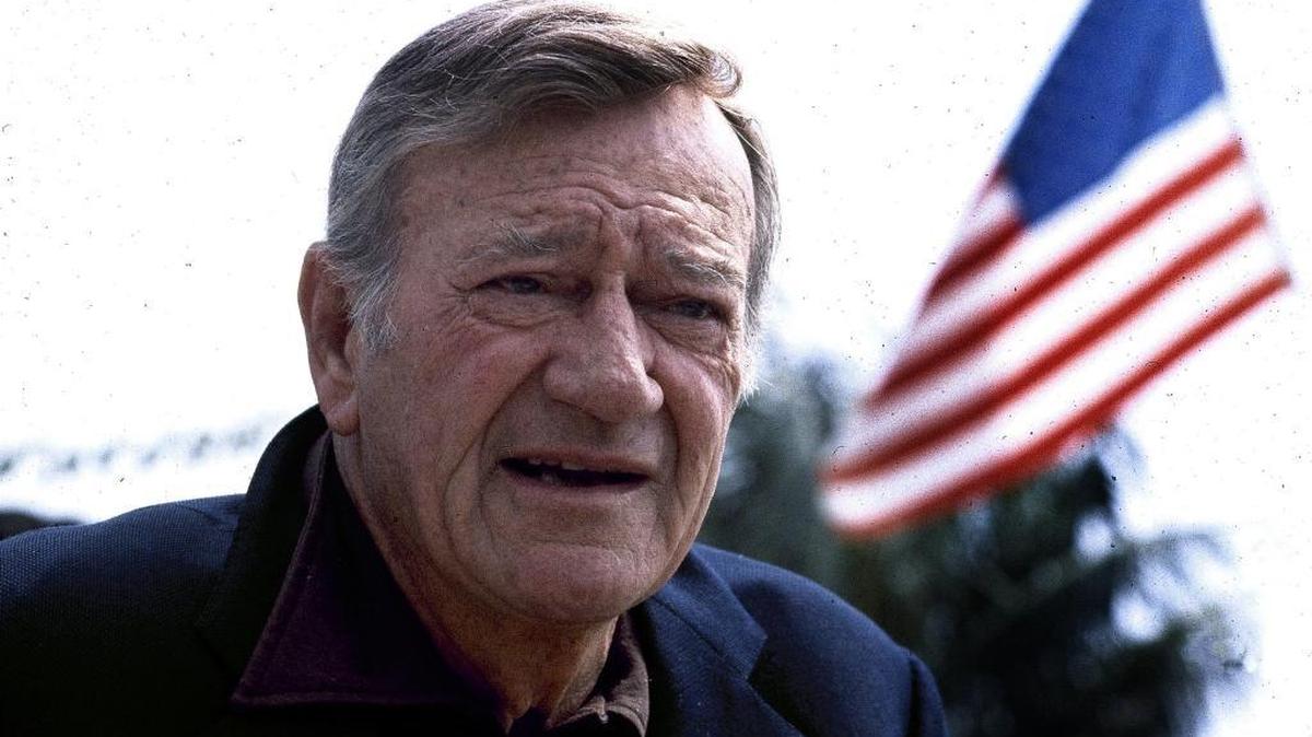 This 1978 file photo shows actor John Wayne wearing a brown plaid coat he wore in 1945's "Flame of Barbary Coast." Last year, Texas proclaimed May 26, Wayne’s birthday, as “John Wayne Day” but on Thursday, the California Assembly refused to do the same.
