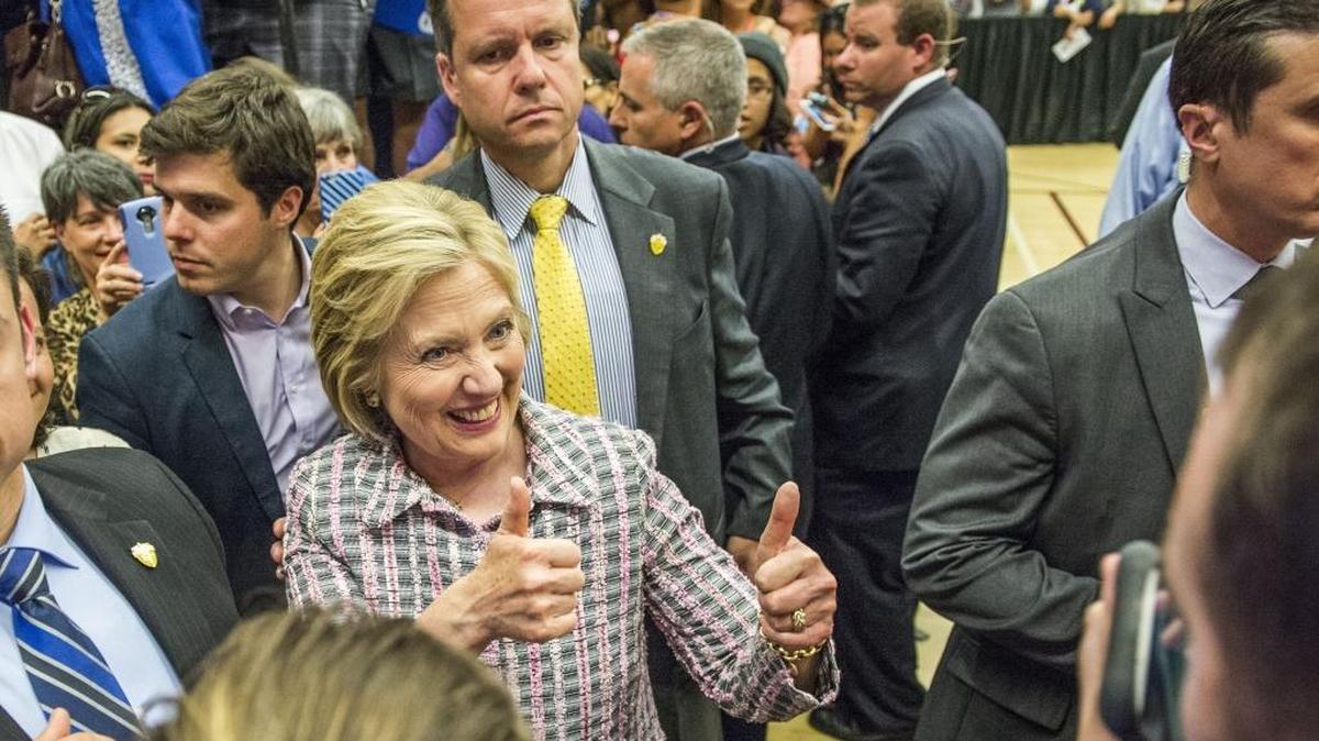 Hillary Clinton gives a thumbs up to supporters as she leaves a campaign stop at Sacramento City College in June 2016.