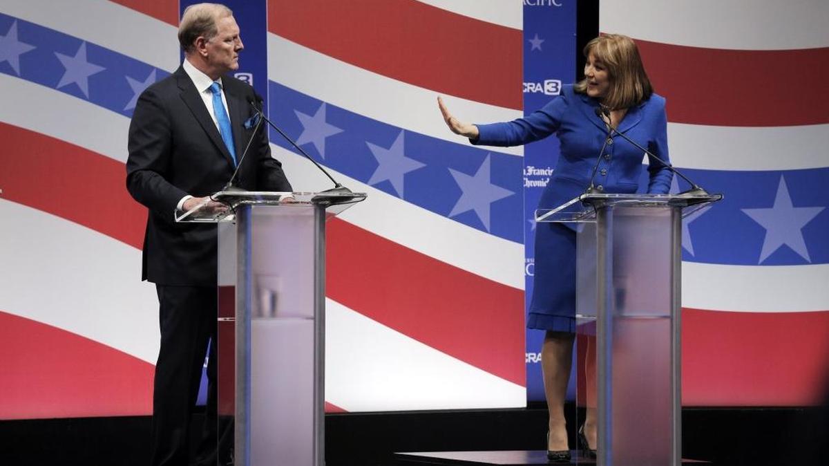 Republican candidate for California's U.S. Senate seat, Duf Sundheim, listens as Democratic Congresswoman Loretta Sanchez speaks during a debate at The University of the Pacific in Stockton on April 25, 2016.