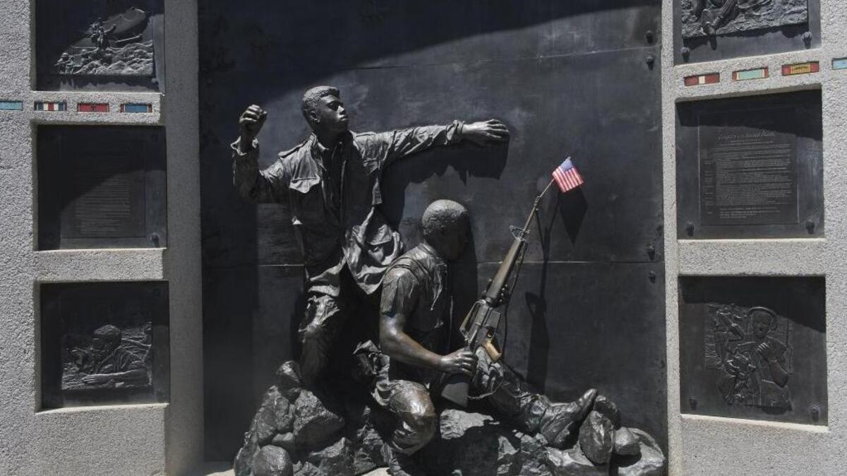 A tiny American flag was among flowers and other mementos left in tribute at the California Vietnam Veterans Memorial on May 25, 2014.