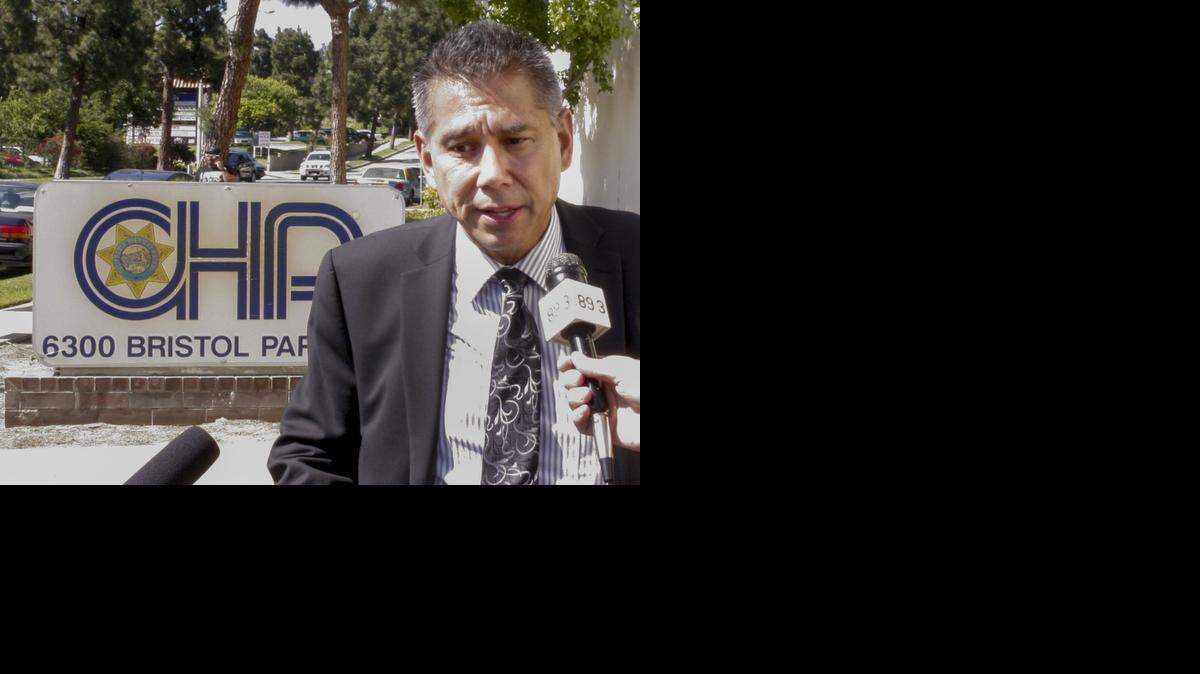 
California Highway Patrol Commissioner Joe Farrow takes questions from the media outside the CHP offices after a meeting with a group of community activists demanding action in response to a cellphone video showing an officer repeatedly punching a woman, in Culver City, Calif., Tuesday, July 8, 2014.
