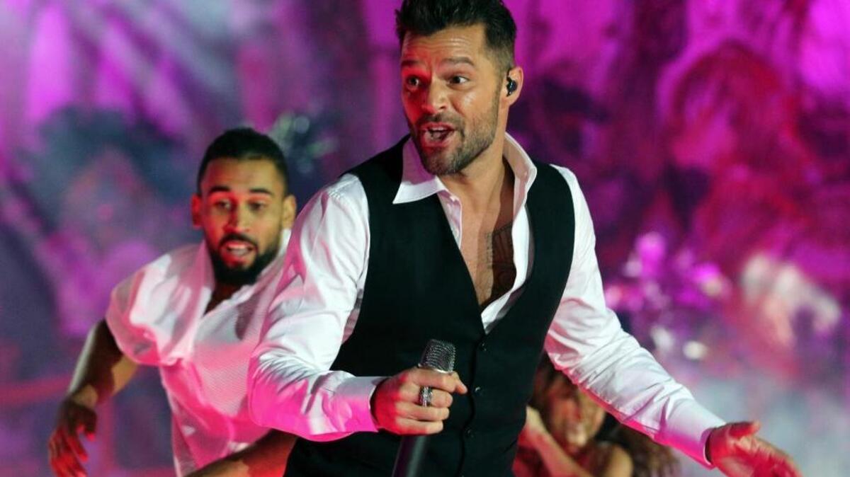 
Puerto Rican singer Ricky Martin performs on stage during the opening ceremony of the Life Ball in front of City Hall in Vienna, Austria.
