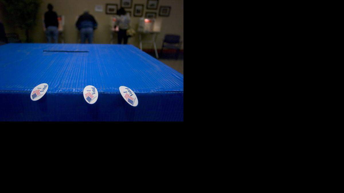 
“I Voted” stickers sit on a ballot box waiting to be handed out to voters at the polling location at El Dorado Hills Fire Department Station 85 on November 8, 2005.
