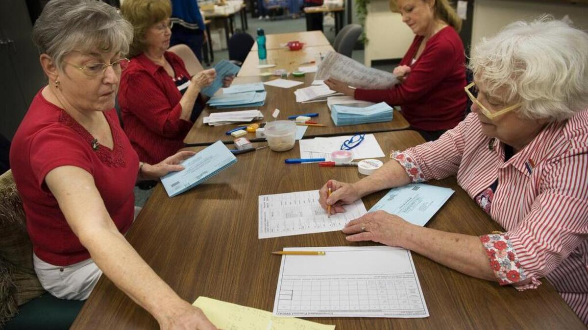 Elections workers count the number of ballots in the El Dorado election office during on election day June 8, 2010. From left are Mary Warden, Doris Morgan and Linda Daniels, all of Placerville, and Alice Maslen of Camino.