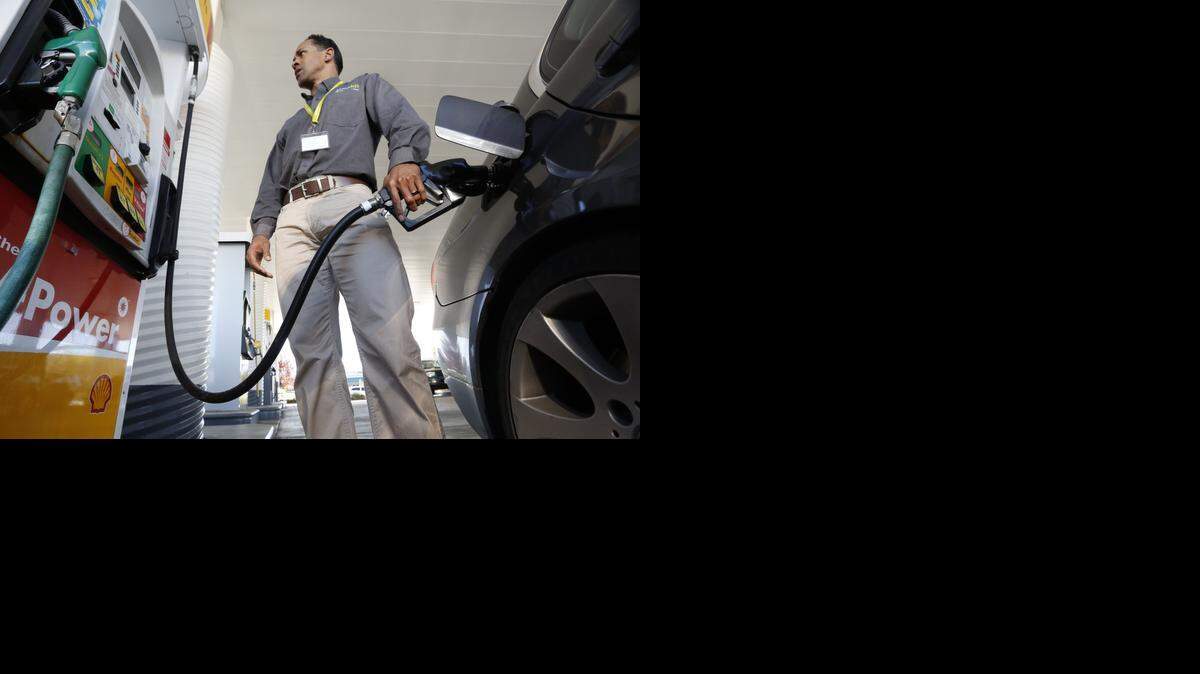
A driver gasses up his car in Sacramento on Friday.
