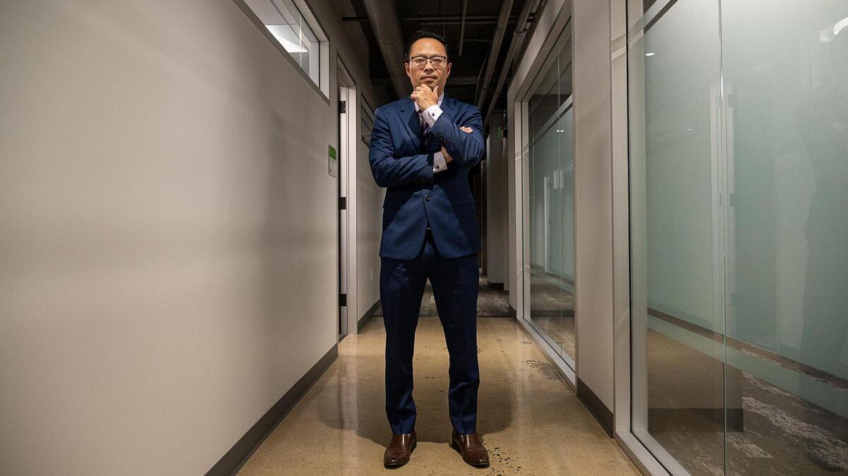 Sacramento Deputy Distric Attorney Thien Ho stands outside conference rooms at the Senator Hotel on Thursday, May 13, 2021, in Sacramento. Ho plans to announce Monday that he is running to succeed Sacramento District Attorney Anne Marie Schubert, who is a candidate for state attorney general.