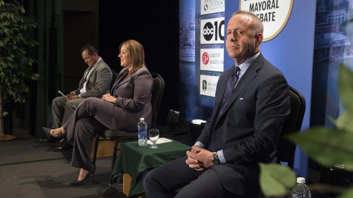 From left, Tony Lopez, Angelique Ashby and Darrell Steinberg wait for the mayoral debate to begin Monday, May 9, 2016, at Sacramento State.