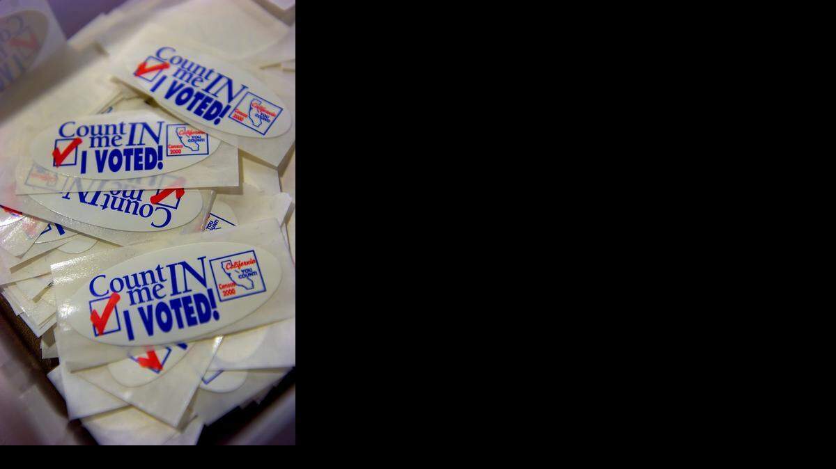 
"I Voted" stickers sit next to the ballot box at the Sacramento County Registrar of Voters office. Bee file photo. 
