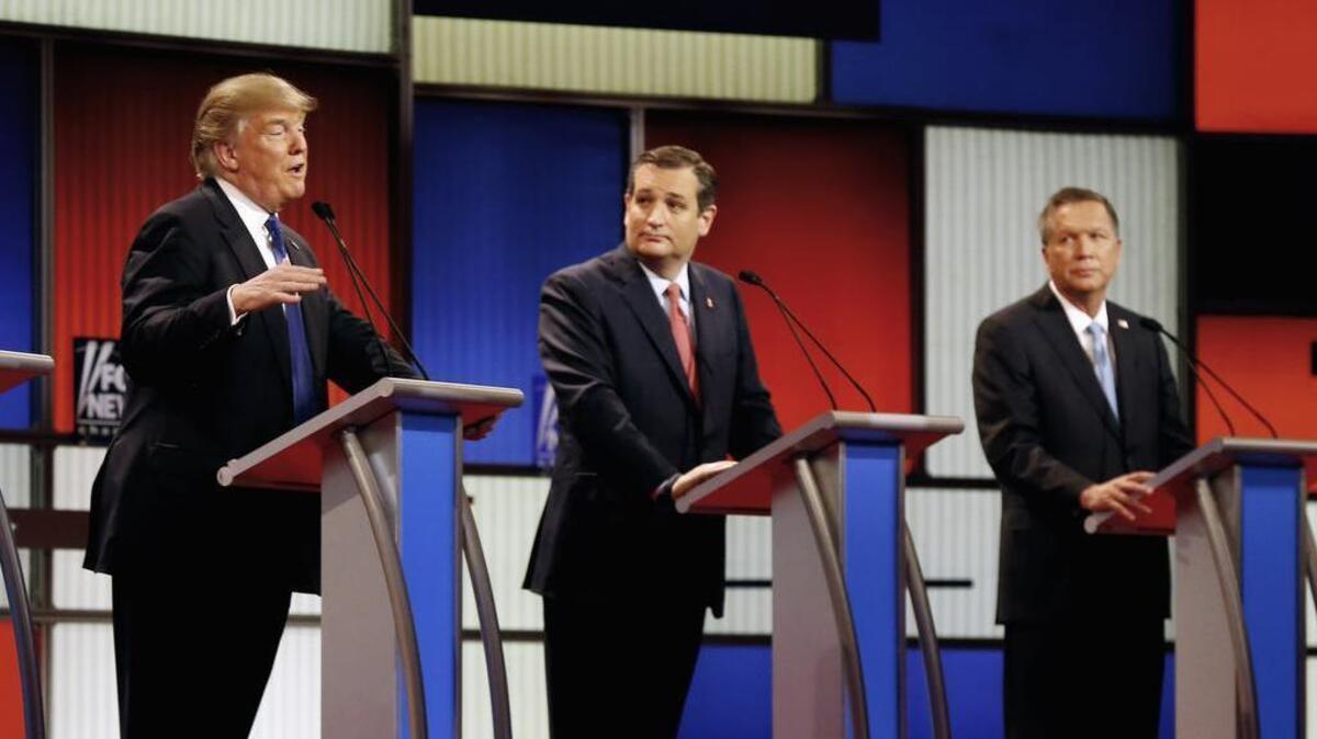 In this March 3, 2016 file photo, Republican presidential candidates, businessman Donald Trump, Sen. Ted Cruz, R-Texas, and Ohio Gov. John Kasich appear during a Republican presidential primary debate at the Fox Theatre in Detroit.