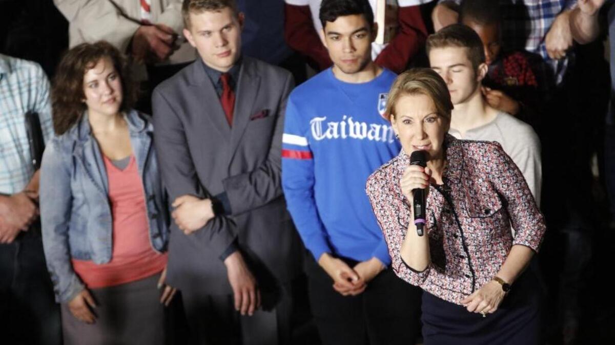 Carly Fiorina, with microphone, speaks at a rally in LaFayette, Ind., on Sunday, May 1, 2016. Fiorina, vice presidential running mate for GOP presidential candidate Sen. Ted Cruz, fell on the stage just after introducing Cruz.