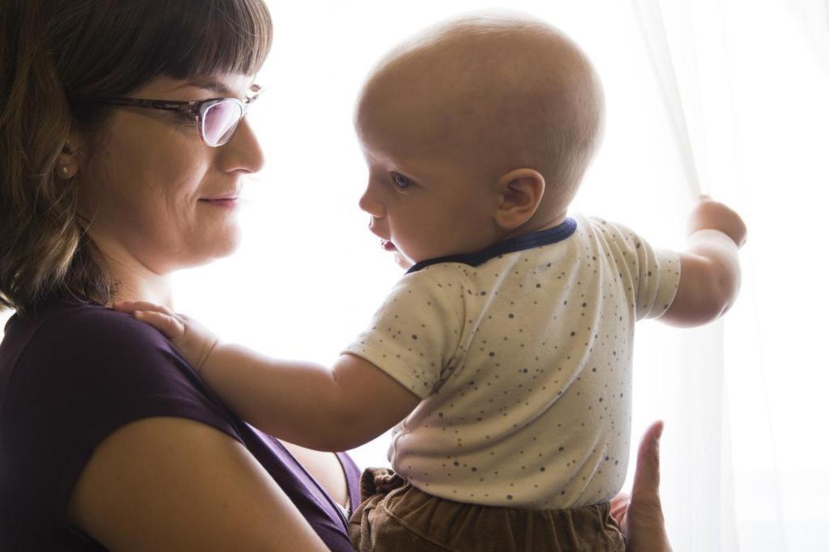  At her Pasadena home, Ariel Loop, 27, holds her 7-month-old son Mobius, who contracted measles in January at Disneyland. Mobius is fully vaccinated, but the measles, mumps and rubella vaccine isn’t given until the age of 1. 