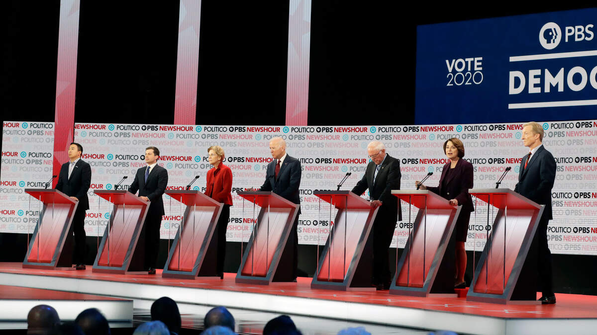 Democratic presidential candidates from left, entrepreneur Andrew Yang, South Bend Mayor Pete Buttigieg, Sen. Elizabeth Warren, D-Mass., former Vice President Joe Biden, Sen. Bernie Sanders, I-Vt., Sen. Amy Klobuchar, D-Minn., and businessman Tom Steyer stand on stage during a Democratic presidential primary debate Thursday, Dec. 19, 2019, in Los Angeles. (AP Photo/Chris Carlson)