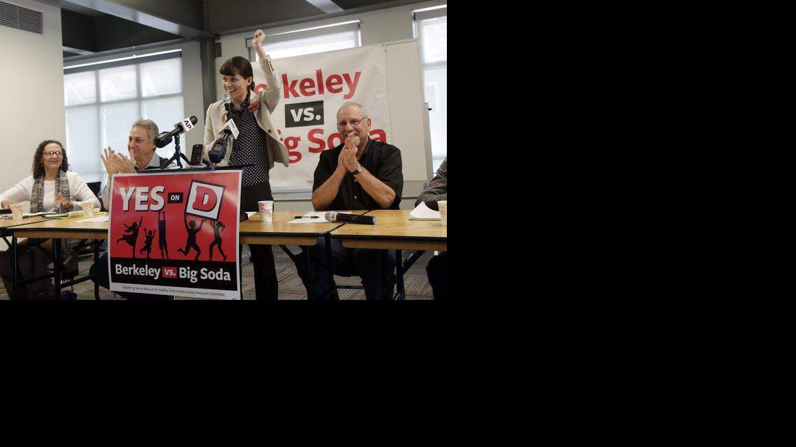 
Campaign manager Sara Soka, center, celebrates with fellow supporters after the passing of Measure D, imposing a sales tax on soda drinks on Nov. 5 in Berkeley. 
