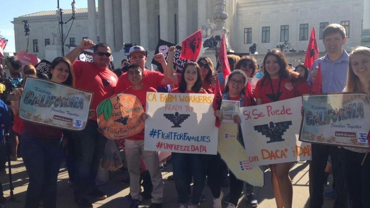 California farmworkers, family members and supporters gather outside the U.S. Supreme Court on Monday as justices take up a key immigration case that could affect thousands of California farm families.