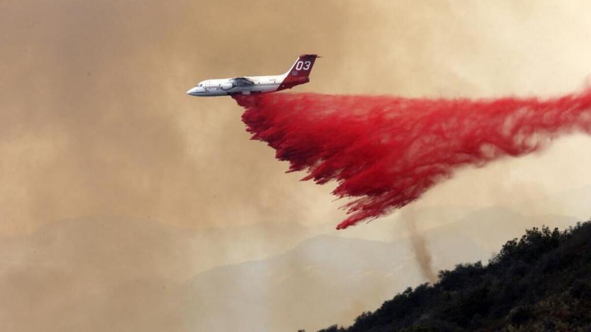 A DC-10 tanker drops fire retardant to combat a wildfire near Santa Barbara, Calif., on Friday, June 17, 2016.