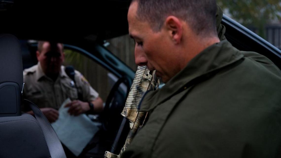 Department of Fish and Game Warden Anthony Marrone checks in the shotgun allegedly used in the 2009 shooting of a sea lion on the Sacramento River.