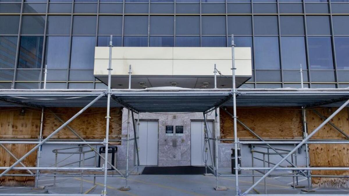 Scaffolding surrounds the Board of Equalization building as a precaution against falling glass in Sacramento on Monday, June 12, 2014. Four of the board’s five governing members have been leasing off-site office space at a cost to taxpayers of about $740,000 per year.