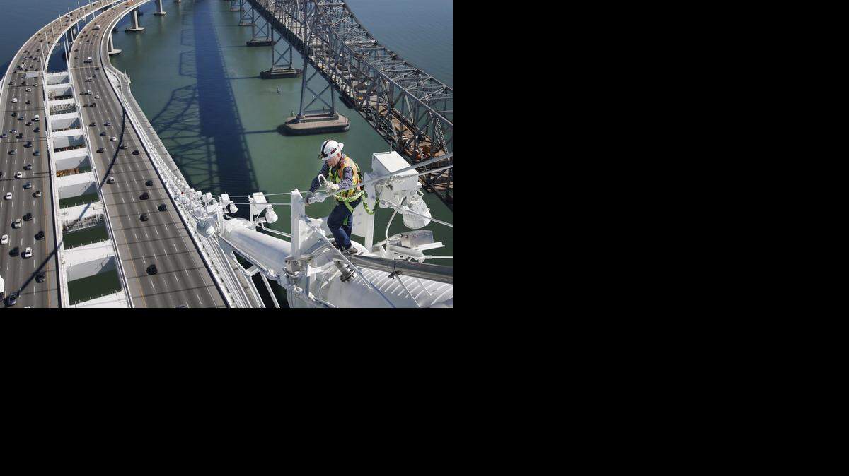 
Caltrans bridge engineer Brian Boal walks the main cable of the Bay Bridge.
