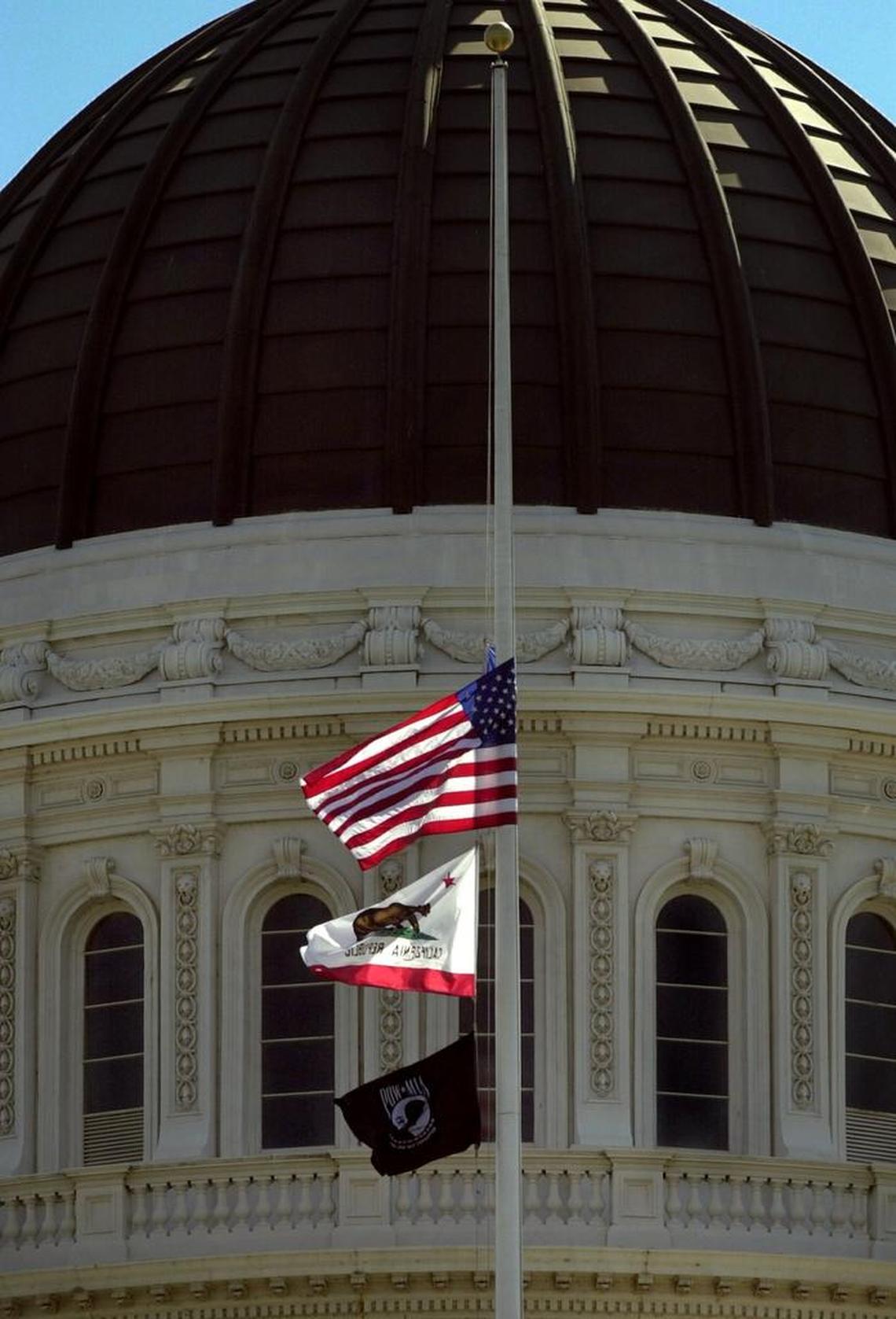 Flags fly at half staff in front of the rotunda of the California State Capitol in this 2001 photo.