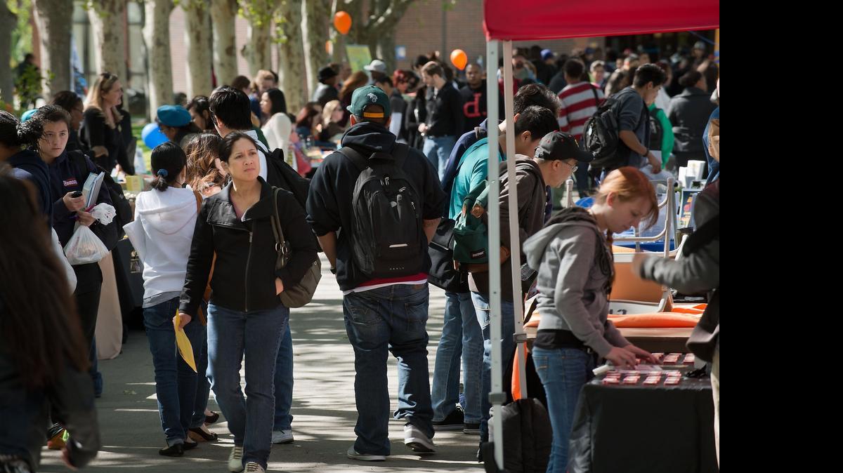 
A crowd of students walks among the booths during the Internship Information Fair at Cosumnes River College in Sacramento on Tuesday, April 9, 2013.
