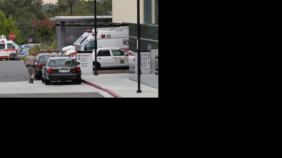 
A California Highway Patrol officer walks toward John Muir Medical Center in Walnut Creek, Calif.
