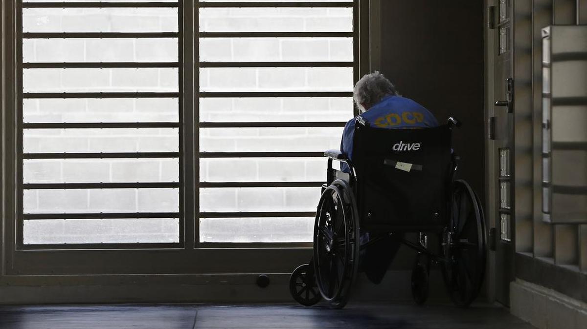 An inmate sits by a window at the mental health unit at the California Department of Corrections and Rehabilitation’s Stockton Health Facility.