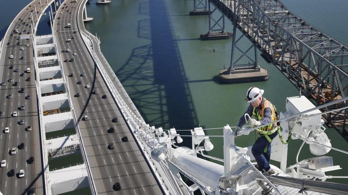 
A Caltrans bridge engineer walks the main cable of the Bay Bridge.
