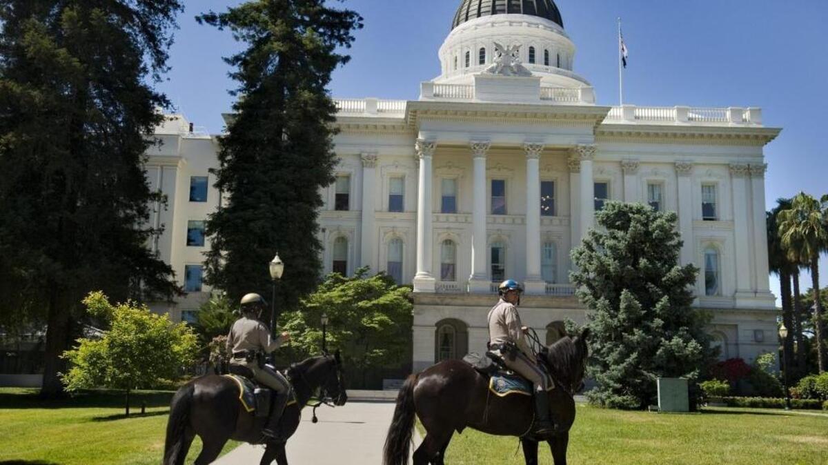 Mounted CHP Officers Eryn Greenfield, left, and Jeff Lane patrol Capitol Park. Being on horses allows them to go places that other vehicles cannot go and have a higher view. May 20, 2011