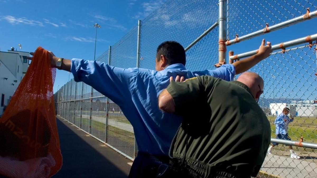 A prison officer searches a subject on his way to drop off his laundry at High Desert State Prison near Susanville in 2006. A special review of the state’s Office of Inspector General chides California prison officials for mishandling and ignoring inmate’s complaints against staff.