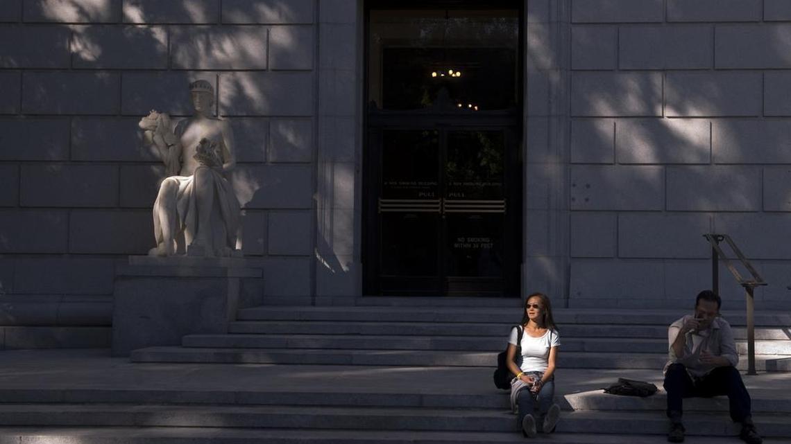 
Light and shadow fall on a statue in front of the Jesse M. Unruh State Office Building in Sacramento on September 11, 2008.
