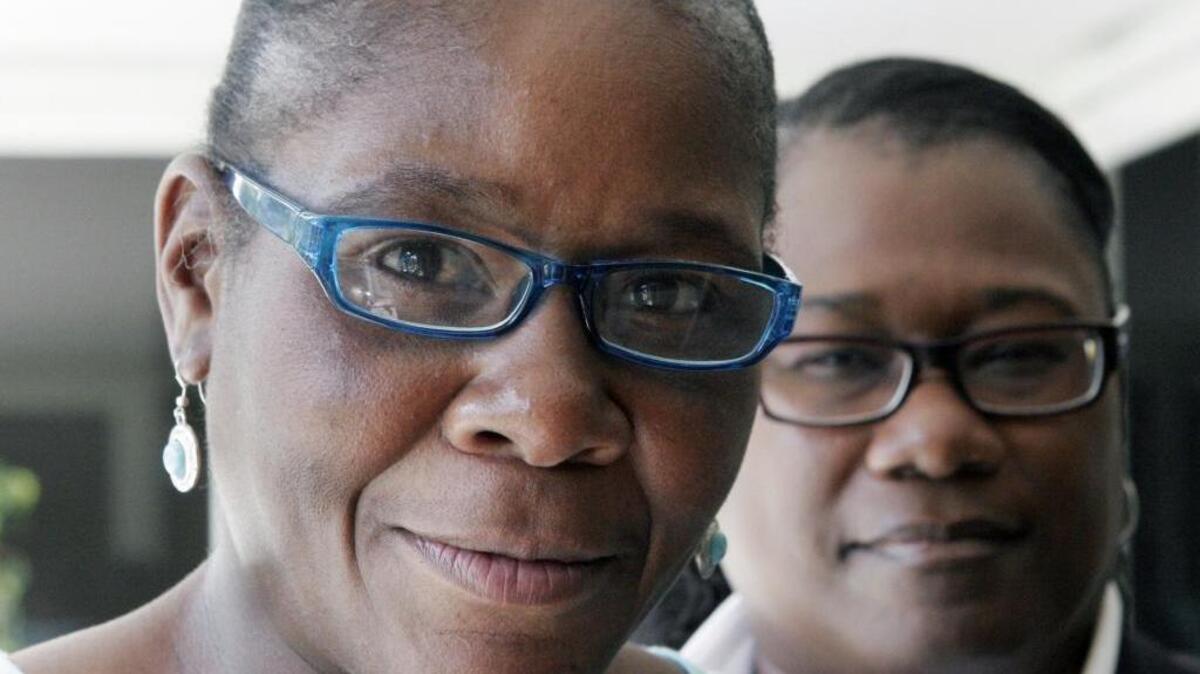 
Marlene Pinnock, left, poses with her attorney, Caree Harper during an interview in Los Angeles. 
